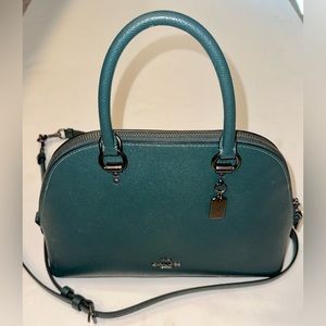 Teal leather used coach purse. Great size and includes original strap.